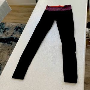 Lululemon Black Leggings with Multicolor striped and reversible Orange Waistband